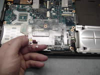 Remove touchpad holder and CMOS battery